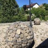 Камень для габионов галька плоская речная темная 70-120мм